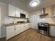 Updated kitchen featuring white cabinets, stainless steel appliances, and butcher block countertops at 10 Buckthorn St., Andrews, SC 29510