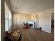 Bright living room featuring wood floors, a fireplace, and large windows for natural light at 10 Buckthorn St., Andrews, SC 29510