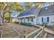 Two-story house with gray siding, walkway, and garden at 101 Bent Tree Ln., Pawleys Island, SC 29585