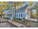 Two-story house with gray siding, double garage, and American flag at 101 Bent Tree Ln., Pawleys Island, SC 29585