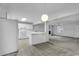 Kitchen with white cabinets, tile floor, island, and access to backyard at 101 Bent Tree Ln., Pawleys Island, SC 29585