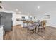 Kitchen and dining area with wood floors and farmhouse table at 109 Foxford Dr., Conway, SC 29526