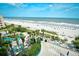 Aerial view shows beach, pool, and surrounding landscape at 1105 S Ocean Blvd. # 516, Myrtle Beach, SC 29577