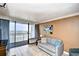 Living room with ocean view and sliding glass doors to balcony at 1105 S Ocean Blvd. # 516, Myrtle Beach, SC 29577