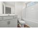 Bright bathroom features a white vanity, toilet, and bathtub with shower and a window at 112 Lakota Loop, Longs, SC 29568