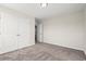 Bedroom with neutral carpet, white trim, light-colored walls, and double-door closet at 112 Lakota Loop, Longs, SC 29568