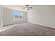 Spacious bedroom featuring carpet, a ceiling fan, and bright natural light at 112 Lakota Loop, Longs, SC 29568