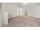 Large bedroom with neutral carpet, two doors, white trim, and overhead lighting at 112 Lakota Loop, Longs, SC 29568