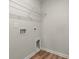 Functional laundry room with wire shelving and hookups for washer and dryer at 112 Lakota Loop, Longs, SC 29568