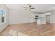 Open concept living area with hardwood floors connecting kitchen and dining space at 112 Lakota Loop, Longs, SC 29568