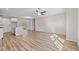 Open concept living area with hardwood floors connecting kitchen and dining space at 112 Lakota Loop, Longs, SC 29568