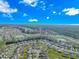 Aerial view of the neighborhood, showcasing homes, ponds, and landscaping at 113 Barn Owl Ct., Carolina Shores, NC 28467