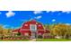 Exterior view of the community's charming red barn clubhouse at 113 Barn Owl Ct., Carolina Shores, NC 28467