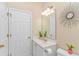 Guest bathroom with single vanity and decorative mirror at 113 Barn Owl Ct., Carolina Shores, NC 28467