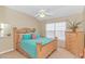 Bright bedroom with a ceiling fan and ample closet space at 113 Barn Owl Ct., Carolina Shores, NC 28467