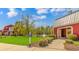 Landscaped entrance to the community with a pond and bus stop at 113 Barn Owl Ct., Carolina Shores, NC 28467