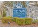 Stone entrance sign welcoming residents to The Farm at Brunswick at 113 Barn Owl Ct., Carolina Shores, NC 28467