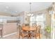 Charming dining area with a round wooden table and four chairs at 113 Barn Owl Ct., Carolina Shores, NC 28467