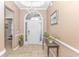 Bright and spacious foyer with tile floors and elegant chandelier at 113 Barn Owl Ct., Carolina Shores, NC 28467