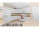 Clean and efficient kitchen featuring white cabinetry and ample counter space at 113 Barn Owl Ct., Carolina Shores, NC 28467