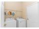 Laundry room with washer, dryer, and shelving for storage at 113 Barn Owl Ct., Carolina Shores, NC 28467