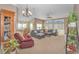 Cozy living room featuring a sectional sofa and large windows at 113 Barn Owl Ct., Carolina Shores, NC 28467