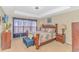 Spacious main bedroom with wood furniture and large windows at 113 Barn Owl Ct., Carolina Shores, NC 28467