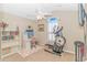 Home office or exercise room with elliptical and built-in shelving at 113 Barn Owl Ct., Carolina Shores, NC 28467