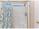 Clean shower with glass enclosure and floral shower curtain at 113 Barn Owl Ct., Carolina Shores, NC 28467