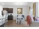 Kitchen and dining area with hardwood floors and modern lighting at 1164 Maxwell Dr., Little River, SC 29566