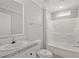 Sparkling clean bathroom features a shower-tub combo and marble-look countertops at 122 Willie Mays Pl., Aynor, SC 29511