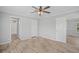 Spacious bedroom with luxury vinyl plank flooring, ceiling fan, and ensuite bathroom at 122 Willie Mays Pl., Aynor, SC 29511
