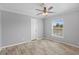 Light-filled bedroom with a large window and modern ceiling fan at 122 Willie Mays Pl., Aynor, SC 29511