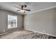 Simple bedroom with wood-look floors and ceiling fan at 122 Willie Mays Pl., Aynor, SC 29511