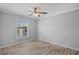 Cozy bedroom with a ceiling fan, natural light, and neutral wall color at 122 Willie Mays Pl., Aynor, SC 29511