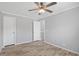 Bright bedroom featuring wood-look floors, ceiling fan, and neutral paint at 122 Willie Mays Pl., Aynor, SC 29511