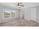 Bright bedroom with a ceiling fan, and two large windows overlooking the landscape at 122 Willie Mays Pl., Aynor, SC 29511