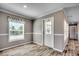 Dining area with wood-look floors and view into kitchen at 122 Willie Mays Pl., Aynor, SC 29511