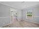 Charming dining area with wood-look floors and open view of kitchen at 122 Willie Mays Pl., Aynor, SC 29511