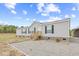 Charming single-story home with gravel front yard and wooden front steps at 122 Willie Mays Pl., Aynor, SC 29511