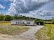 Charming single-story home with gravel driveway and separate covered storage at 122 Willie Mays Pl., Aynor, SC 29511