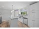 Bright kitchen with island, stainless steel appliances, white cabinets, and a window overlooking the outdoors at 122 Willie Mays Pl., Aynor, SC 29511