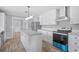 Bright kitchen with island, stainless steel appliances, and white cabinets at 122 Willie Mays Pl., Aynor, SC 29511