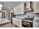 Modern kitchen with stainless steel range and granite countertops at 122 Willie Mays Pl., Aynor, SC 29511