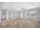 Open living room features a ceiling fan, large window, and LVP flooring at 122 Willie Mays Pl., Aynor, SC 29511