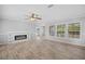 Bright and open living room with fireplace, recessed lights, and wood-look floors at 122 Willie Mays Pl., Aynor, SC 29511