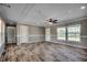 Bright living room with wood-look floors and ceiling fan at 122 Willie Mays Pl., Aynor, SC 29511