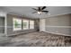 Living room with ceiling fan and large windows at 122 Willie Mays Pl., Aynor, SC 29511