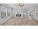 Bright, neutral living room with a fireplace, wood-look floors and recessed lighting at 122 Willie Mays Pl., Aynor, SC 29511