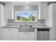 Close-up of the kitchen sink with white cabinets and a window overlooking the outdoors at 122 Willie Mays Pl., Aynor, SC 29511
